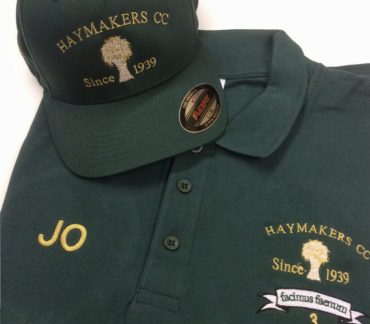 Dark green T shirt with matching cap