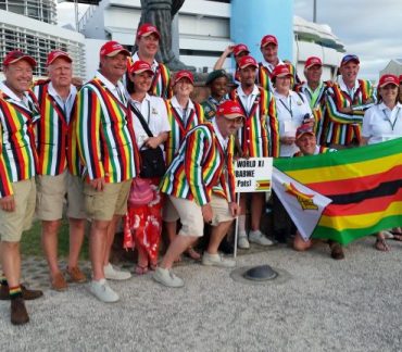 Team photo in striped blazers