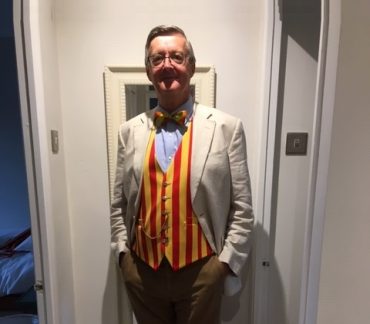 Man in red and yellow striped waistcoat