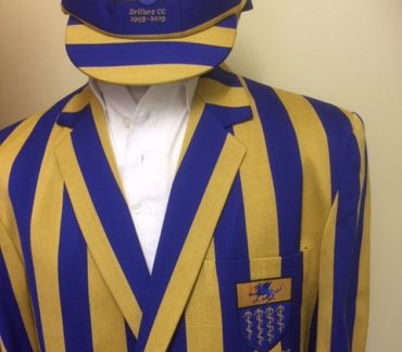Blue and yellow striped blazer and cap
